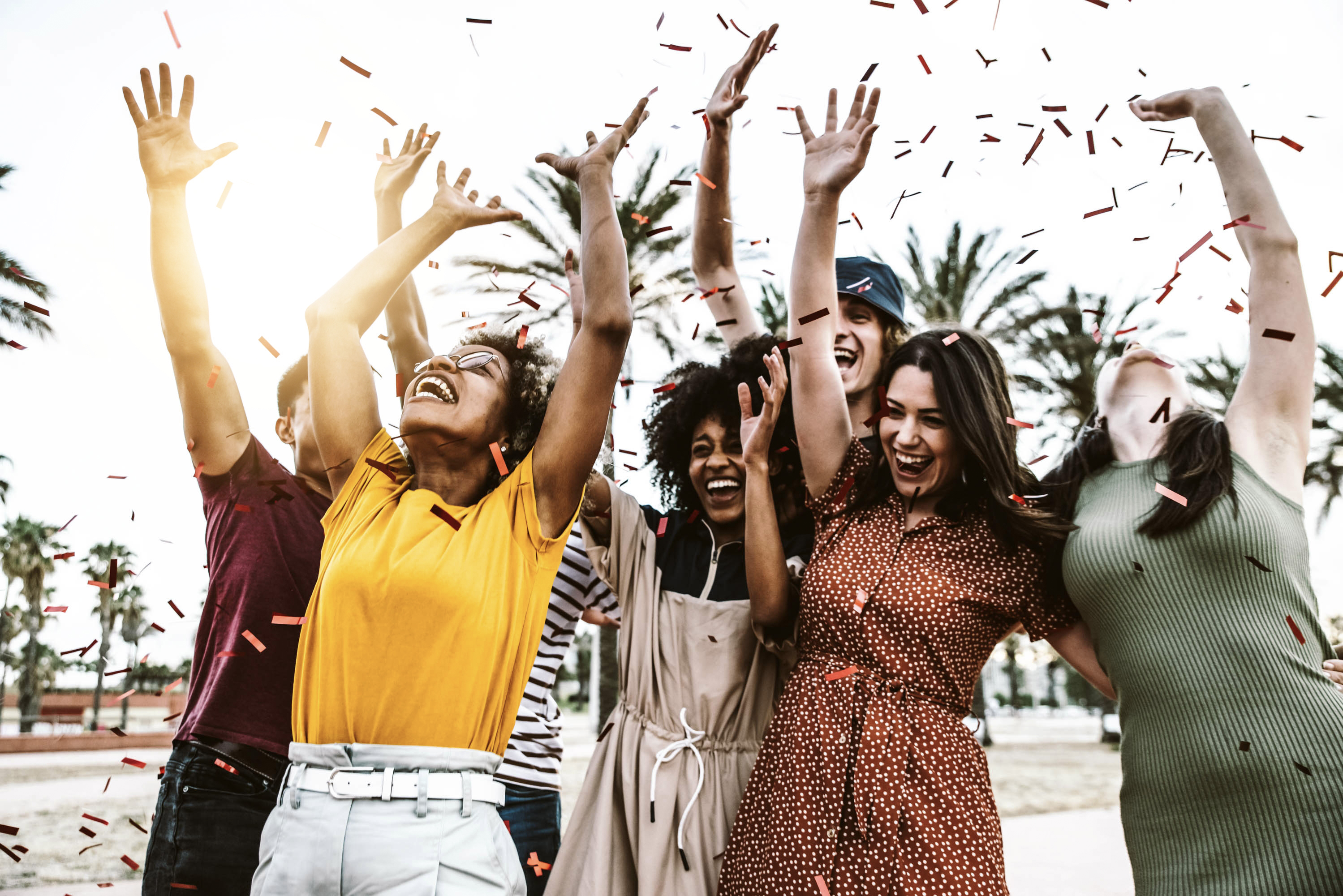 group-of-friends-enjoying-party-throwing-confetti-2022-01-18-23-42-12-utc